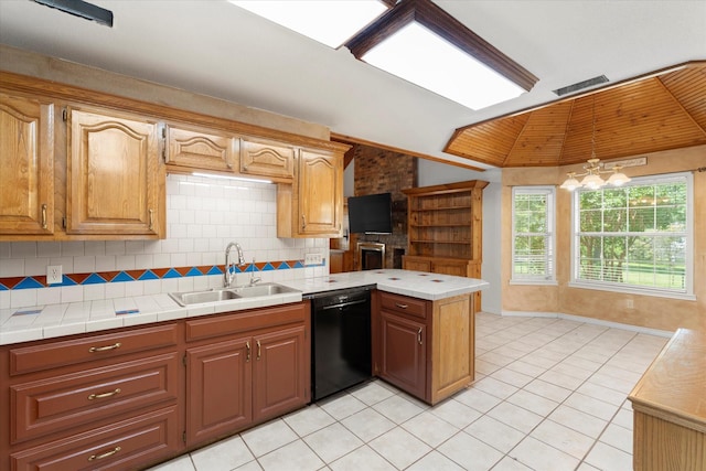 410 Etheridge Rd, Canton, TX 75103 - kitchen featuring black dishwasher, a sink, a peninsula, light tile patterned floors, and backsplash