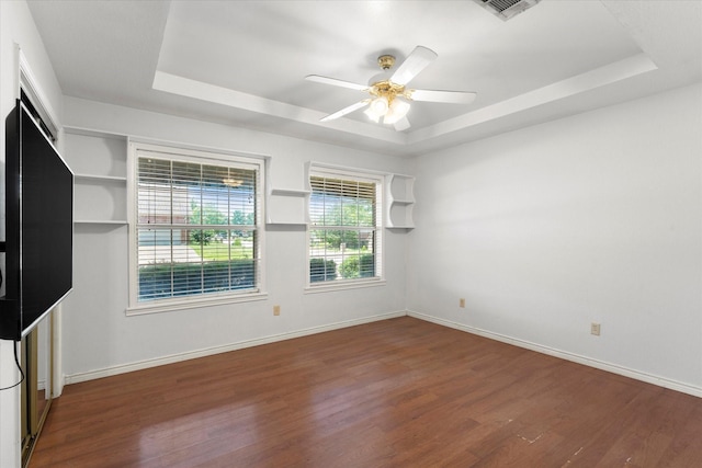 410 Etheridge Rd, Canton, TX 75103 - unfurnished room with a raised ceiling, wood finished floors, ceiling fan, and baseboards