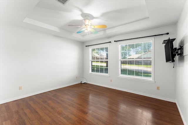 410 Etheridge Rd, Canton, TX 75103 - empty room with a raised ceiling, wood finished floors, baseboards, and a ceiling fan