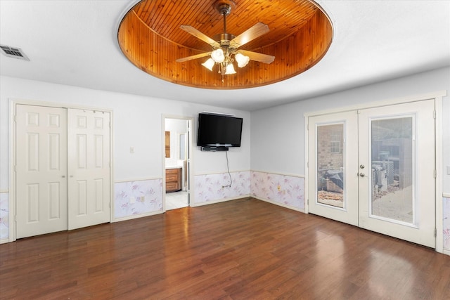 410 Etheridge Rd, Canton, TX 75103 - unfurnished bedroom featuring french doors, wood finished floors, a tray ceiling, access to outside, and ceiling fan
