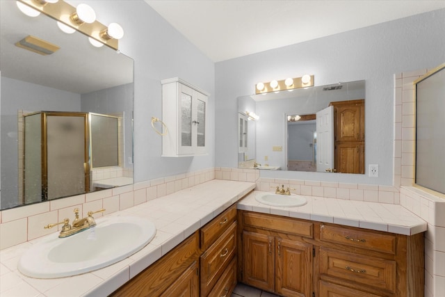 410 Etheridge Rd, Canton, TX 75103 - bathroom featuring vanity, a shower stall, lofted ceiling, and decorative backsplash