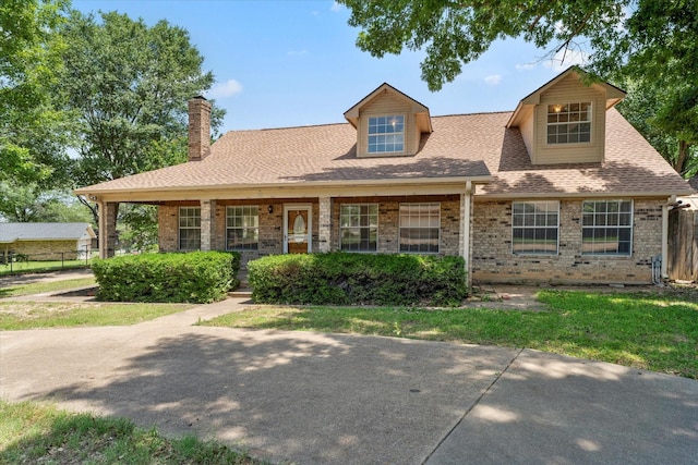 410 Etheridge Rd, Canton, TX 75103 - view of front of house with a chimney, brick siding, a shingled roof, and a porch