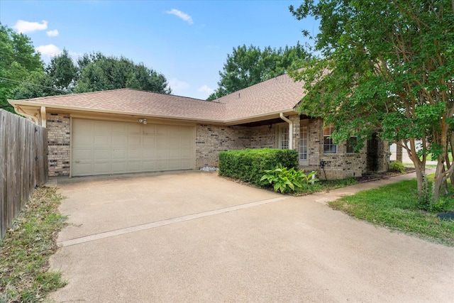 410 Etheridge Rd, Canton, TX 75103 - single story home featuring brick siding, concrete driveway, an attached garage, and roof with shingles