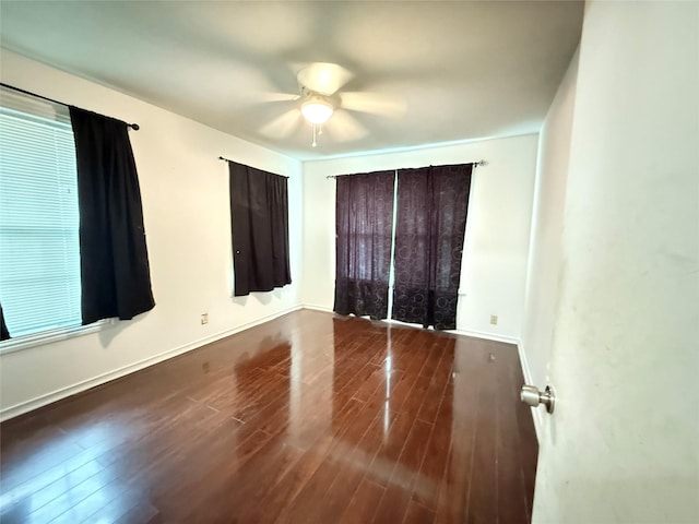 3106 Marydale Rd, Garland, TX 75041 - unfurnished bedroom with wood finished floors, a ceiling fan, and baseboards