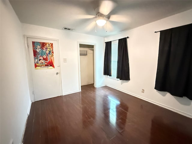 3106 Marydale Rd, Garland, TX 75041 - unfurnished bedroom featuring dark wood-type flooring, baseboards, and a ceiling fan