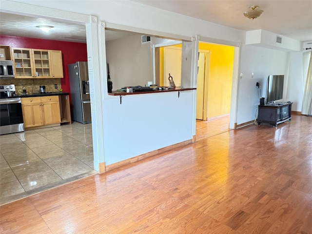 3106 Marydale Rd, Garland, TX 75041 - unfurnished living room featuring light wood finished floors and baseboards
