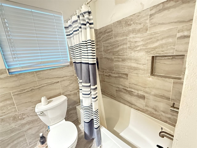 3106 Marydale Rd, Garland, TX 75041 - bathroom featuring tile walls, shower / bathtub combination with curtain, and toilet