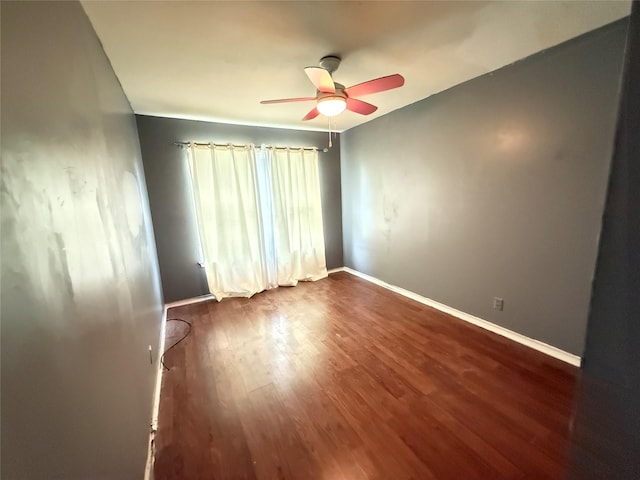 3106 Marydale Rd, Garland, TX 75041 - spare room with ceiling fan, dark wood-type flooring, and baseboards