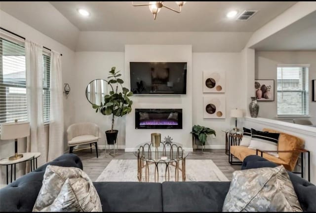 1568 Glacier Rdg, Royse City, TX 75189 - living room featuring wood finished floors, baseboards, plenty of natural light, and recessed lighting