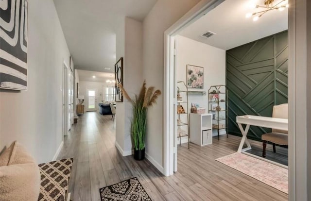 1568 Glacier Rdg, Royse City, TX 75189 - hallway with light wood finished floors, baseboards, and a chandelier