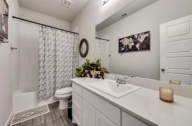 1568 Glacier Rdg, Royse City, TX 75189 - bathroom featuring vanity, toilet, wood finished floors, and shower / tub combo