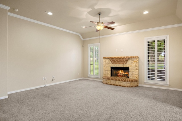 7017 Westover Dr, Granbury, TX 76049 - unfurnished living room with a ceiling fan, crown molding, baseboards, carpet floors, and a fireplace