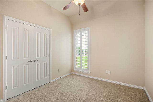 7017 Westover Dr, Granbury, TX 76049 - unfurnished bedroom with light colored carpet, baseboards, a closet, lofted ceiling, and a ceiling fan