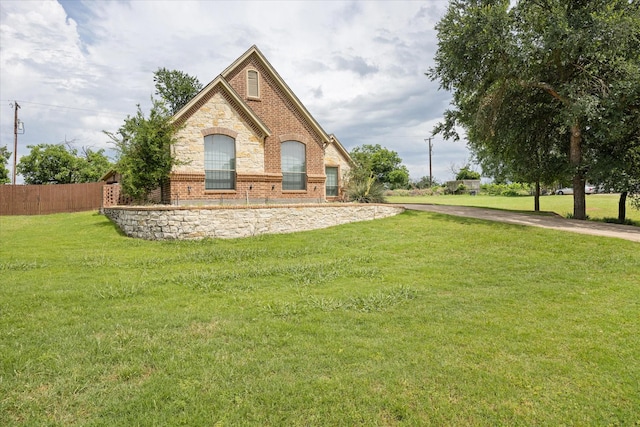 7017 Westover Dr, Granbury, TX 76049 - view of home's exterior with brick siding and stone siding