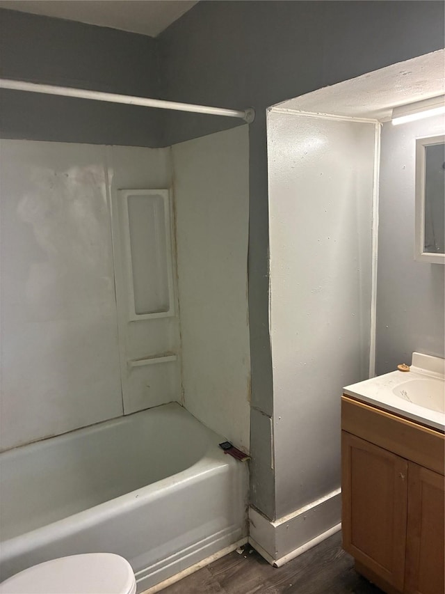 1435 Natalie St, Shreveport, LA 71108 - bathroom with vanity, toilet, wood finished floors, and bathing tub / shower combination
