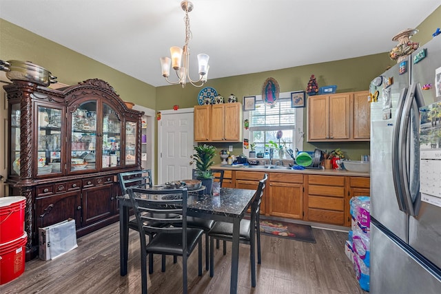 1615 Mitchell Ave, Waco, TX 76708 - kitchen featuring freestanding refrigerator, a chandelier, dark wood finished floors, and a sink