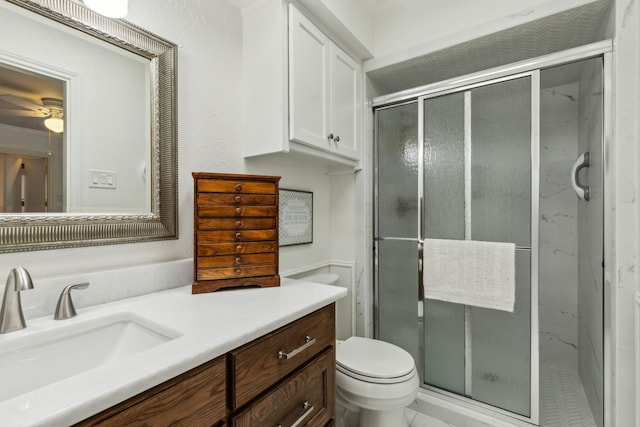 7422 Whispering Pines Dr, Dallas, TX 75248 - bathroom with vanity, toilet, a shower stall, and ceiling fan