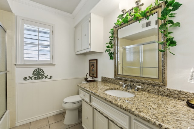 7422 Whispering Pines Dr, Dallas, TX 75248 - full bath with vanity, toilet, crown molding, wainscoting, and tile patterned floors