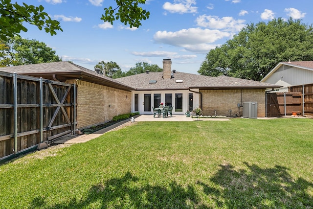 7422 Whispering Pines Dr, Dallas, TX 75248 - rear view of property with central air condition unit, brick siding, and a gate
