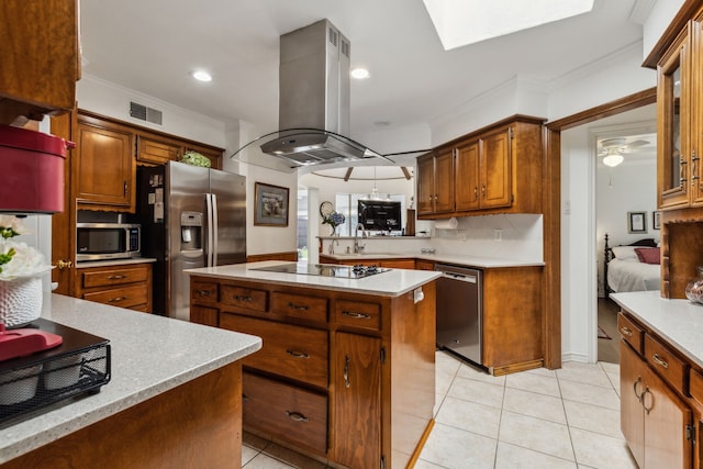 7422 Whispering Pines Dr, Dallas, TX 75248 - kitchen with appliances with stainless steel finishes, island range hood, ornamental molding, backsplash, and light countertops