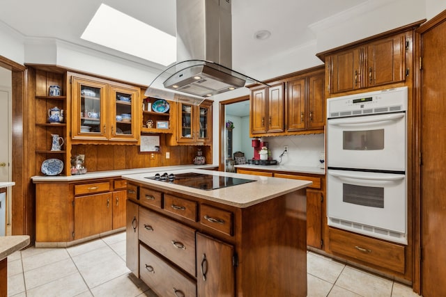 7422 Whispering Pines Dr, Dallas, TX 75248 - kitchen featuring island exhaust hood, black electric cooktop, white double oven, open shelves, and light tile patterned floors