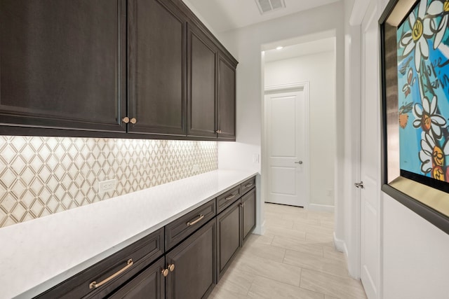 12305 Glenbrook St, Denton, TX 76207 - bar featuring decorative backsplash and baseboards