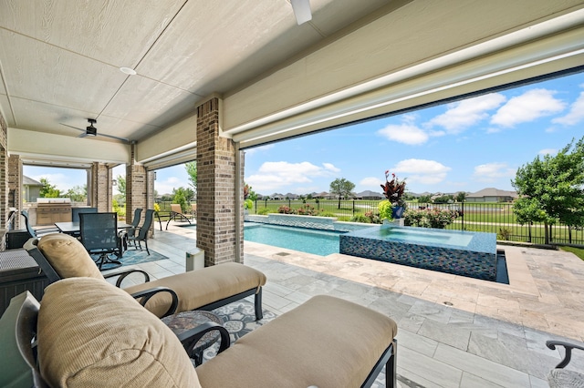 12305 Glenbrook St, Denton, TX 76207 - fenced backyard with ceiling fan, a patio, outdoor dining area, a pool with connected hot tub, and area for grilling