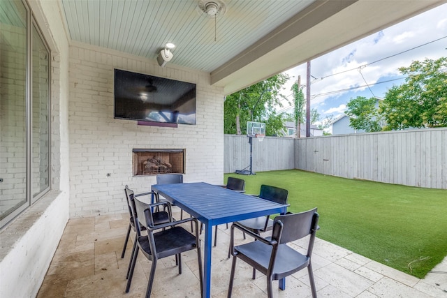 3929 Lively Ln, Dallas, TX 75220 - view of patio with outdoor dining area and an outdoor brick fireplace