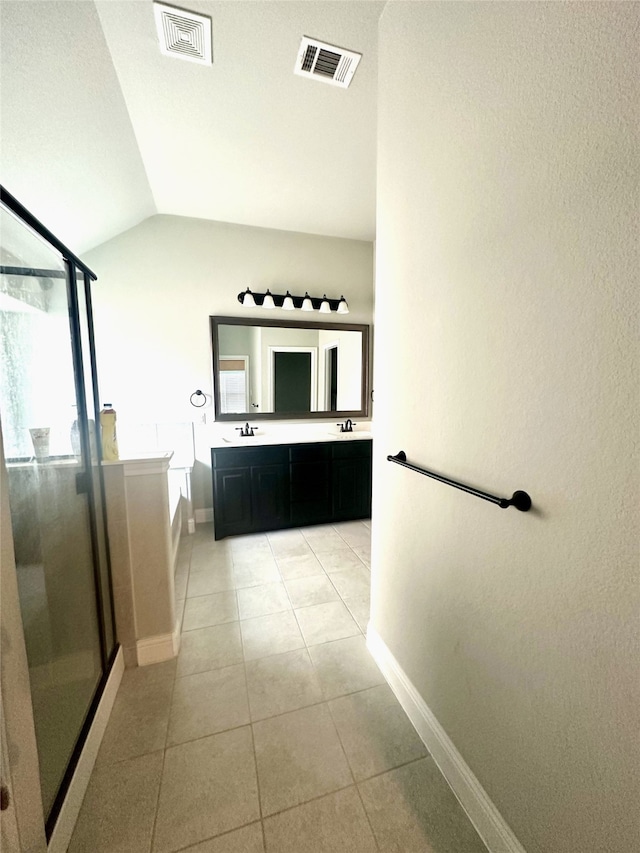 6020 Harwich Ln, Fort Worth, TX 76179 - full bath featuring a stall shower, a garden tub, lofted ceiling, baseboards, and double vanity