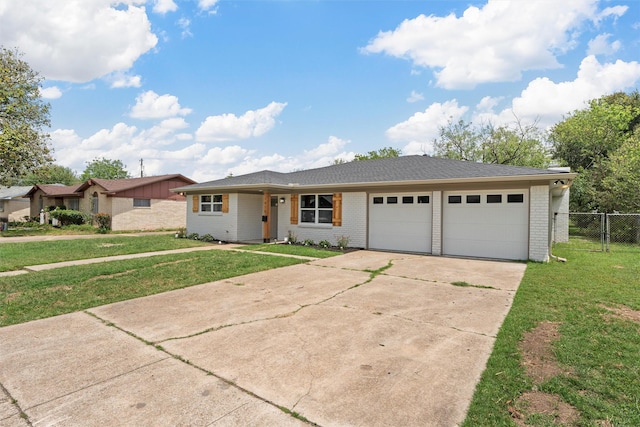 1816 Evans Dr, Waco, TX 76705 - view of front facade featuring a garage, concrete driveway, and brick siding
