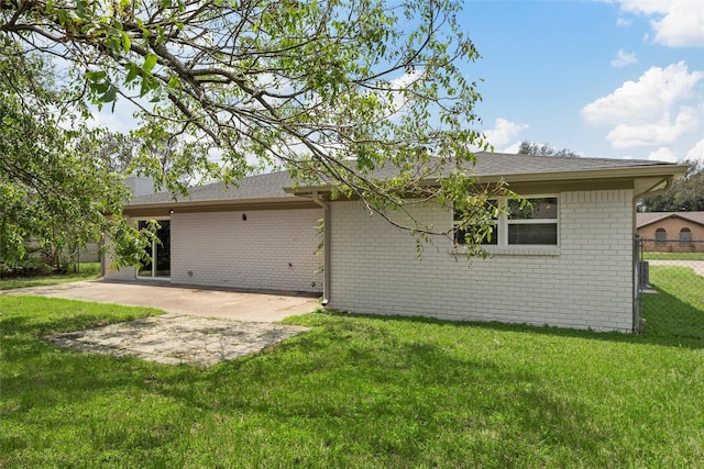1816 Evans Dr, Waco, TX 76705 - rear view of property featuring brick siding, a patio area, and roof with shingles