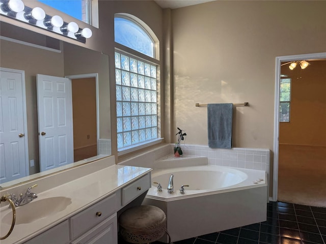 2802 Sunrise Dr, Rowlett, TX 75088 - bathroom featuring tile patterned floors, a bath, and vanity
