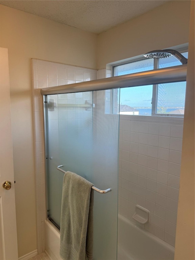 2802 Sunrise Dr, Rowlett, TX 75088 - bathroom with bath / shower combo with glass door