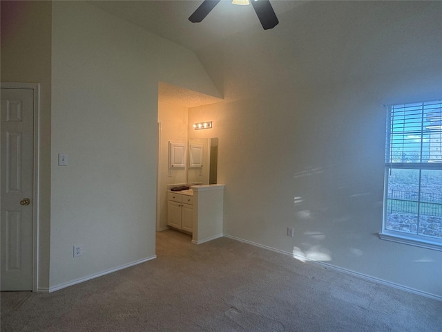 2802 Sunrise Dr, Rowlett, TX 75088 - unfurnished bedroom with light colored carpet, lofted ceiling, baseboards, and ceiling fan