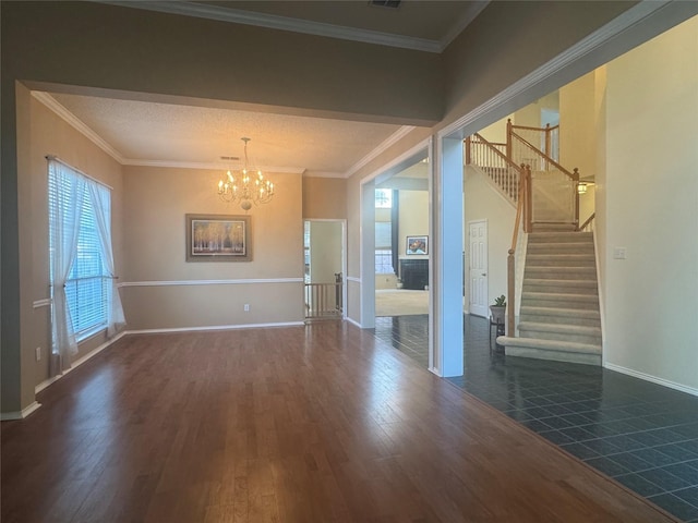 2802 Sunrise Dr, Rowlett, TX 75088 - unfurnished living room with a chandelier, wood finished floors, stairway, baseboards, and crown molding