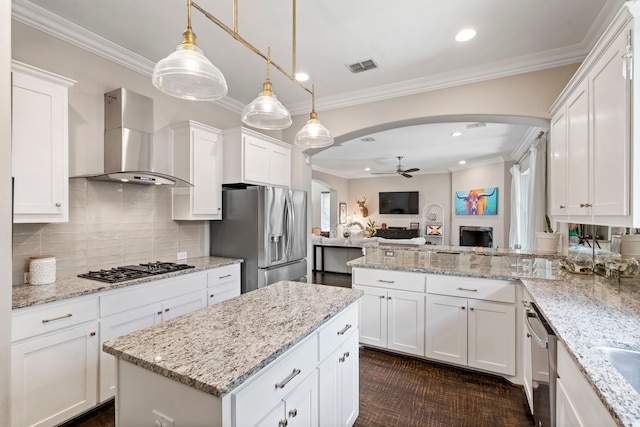 857 N Glasgow Dr Unit C, Dallas, TX 75214 - kitchen with appliances with stainless steel finishes, wall chimney range hood, arched walkways, a ceiling fan, and recessed lighting