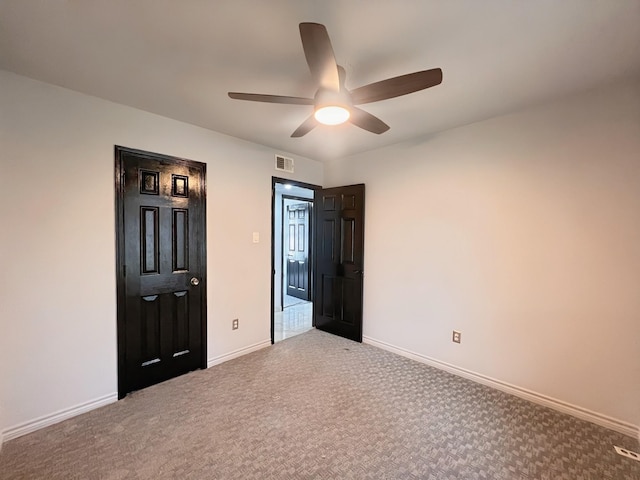 102 Janis St, Alvarado, TX 76009 - unfurnished bedroom featuring carpet, baseboards, and ceiling fan