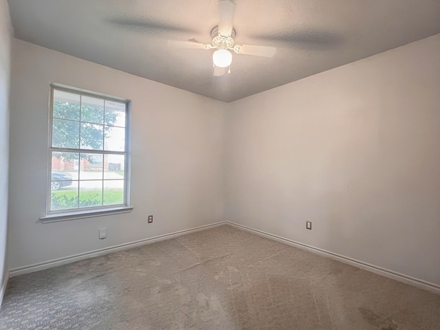 102 Janis St, Alvarado, TX 76009 - carpeted spare room featuring baseboards and ceiling fan