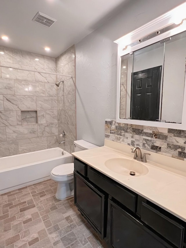 102 Janis St, Alvarado, TX 76009 - bathroom featuring vanity, toilet, tub / shower combination, and brick patterned flooring