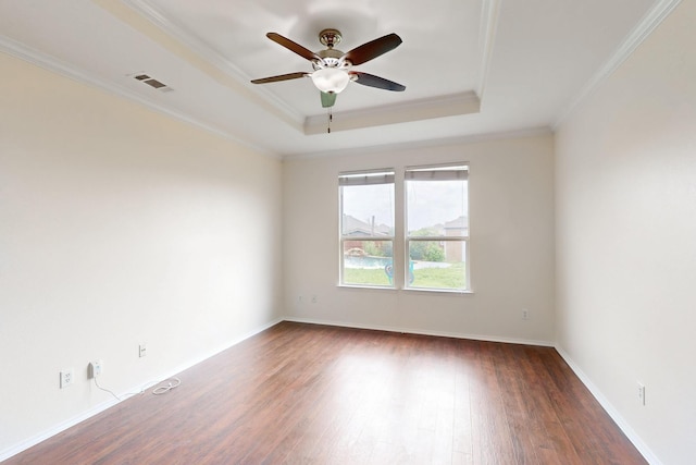 1278 Wysteria Ln, Burleson, TX 76028 - empty room with a tray ceiling, wood finished floors, a ceiling fan, crown molding, and baseboards