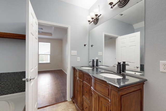1278 Wysteria Ln, Burleson, TX 76028 - full bathroom with double vanity, a bath, and wood finished floors