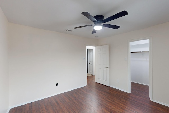 1278 Wysteria Ln, Burleson, TX 76028 - unfurnished bedroom with dark wood-style flooring, a spacious closet, baseboards, and a closet