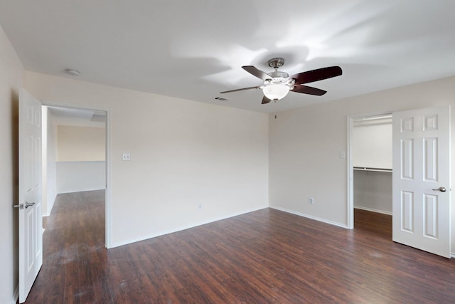 1278 Wysteria Ln, Burleson, TX 76028 - unfurnished bedroom with wood finished floors, a walk in closet, a closet, and baseboards