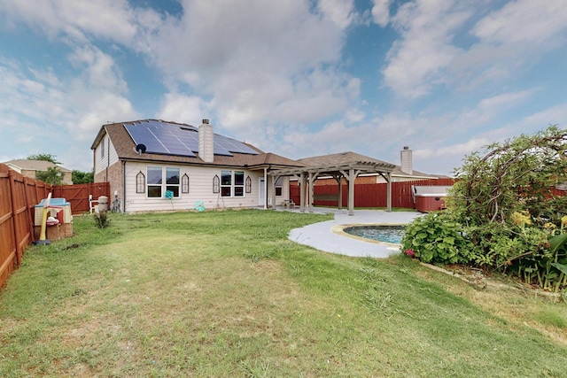 1278 Wysteria Ln, Burleson, TX 76028 - back of house with a hot tub, solar panels, a patio, and a chimney