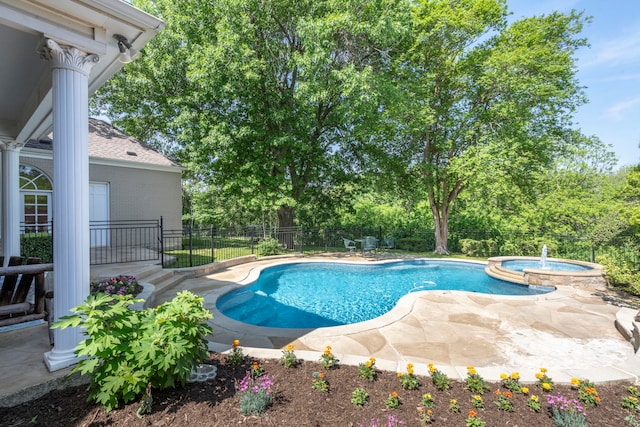 7215 Abrams Place Ct, Dallas, TX 75231 - view of swimming pool with a fenced backyard, a patio, a pool with connected hot tub, and view of scattered trees