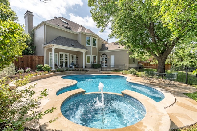 7215 Abrams Place Ct, Dallas, TX 75231 - view of swimming pool featuring french doors, a pool with connected hot tub, and a patio