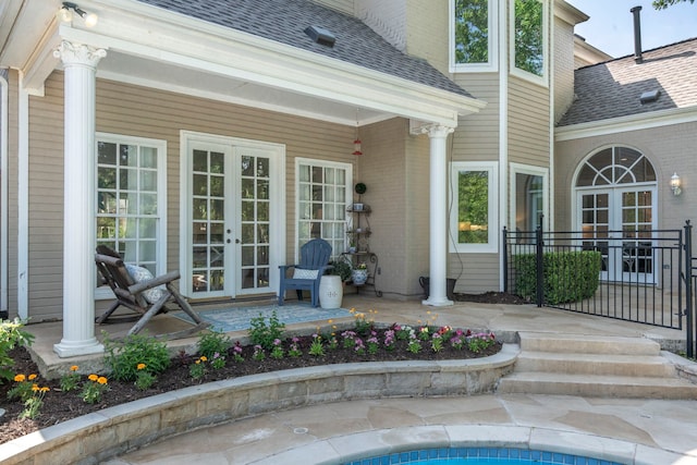 7215 Abrams Place Ct, Dallas, TX 75231 - doorway to property with french doors, roof with shingles, and brick siding