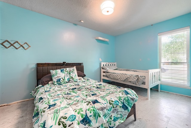 2123 Sunrise Trl, Richardson, TX 75081 - bedroom with baseboards and a textured ceiling