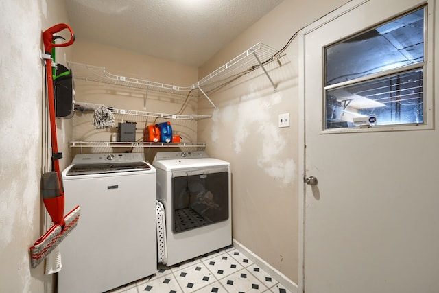 2123 Sunrise Trl, Richardson, TX 75081 - washroom with washer and clothes dryer and baseboards
