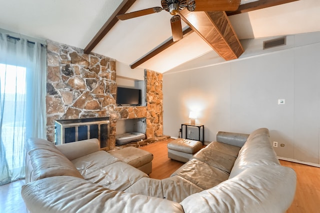 2123 Sunrise Trl, Richardson, TX 75081 - living area featuring a ceiling fan, wood finished floors, and a stone fireplace